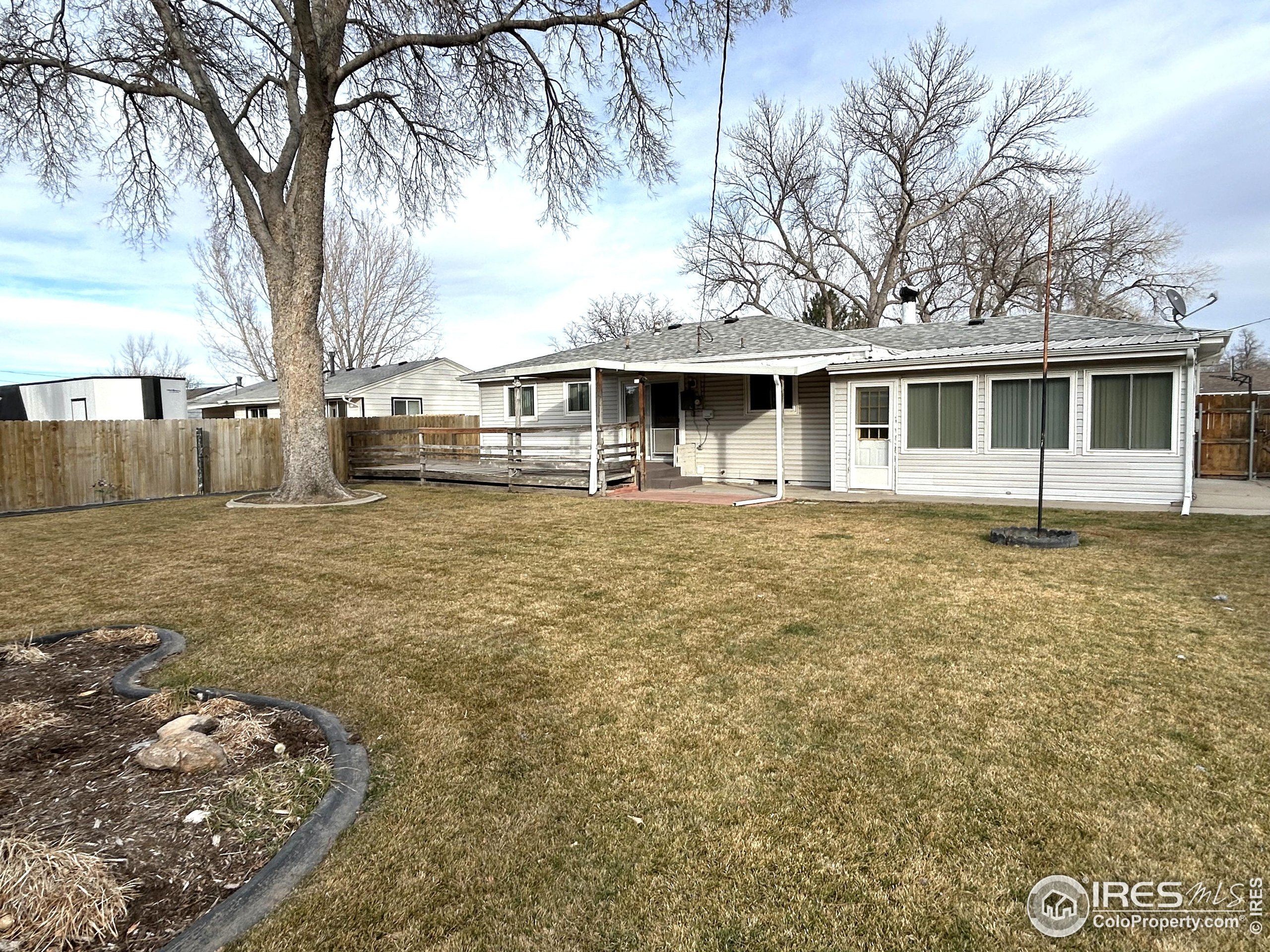 123 Balsam Street Fort Morgan, CO 80701 - Photo 34 of 34 a front view of a house with garden