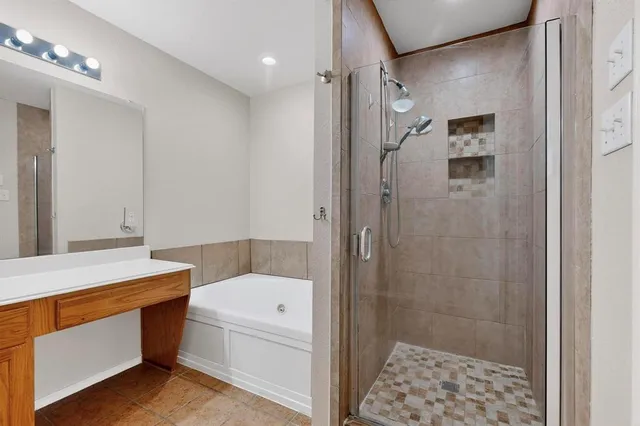 a bathroom with a sink a toilet a shower and a mirror