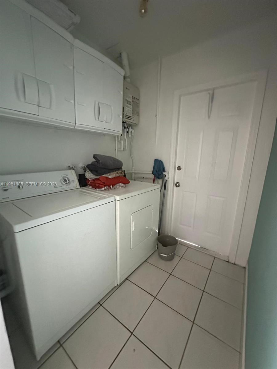 6443 Perry Street Hollywood, FL 33024 - Photo 14 of 24 a utility room with dryer and washer