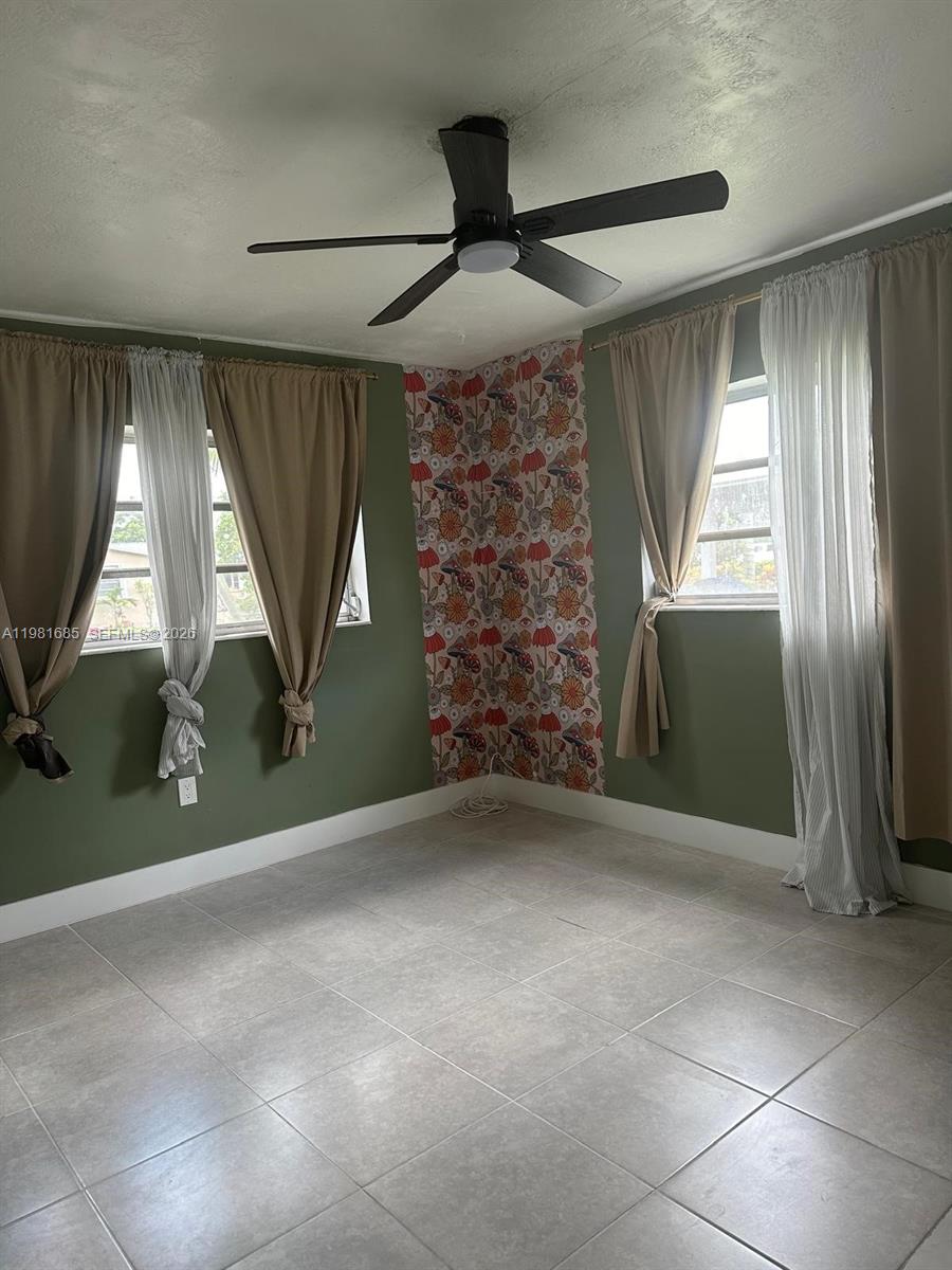 6443 Perry Street Hollywood, FL 33024 - Photo 20 of 24 an empty room with windows