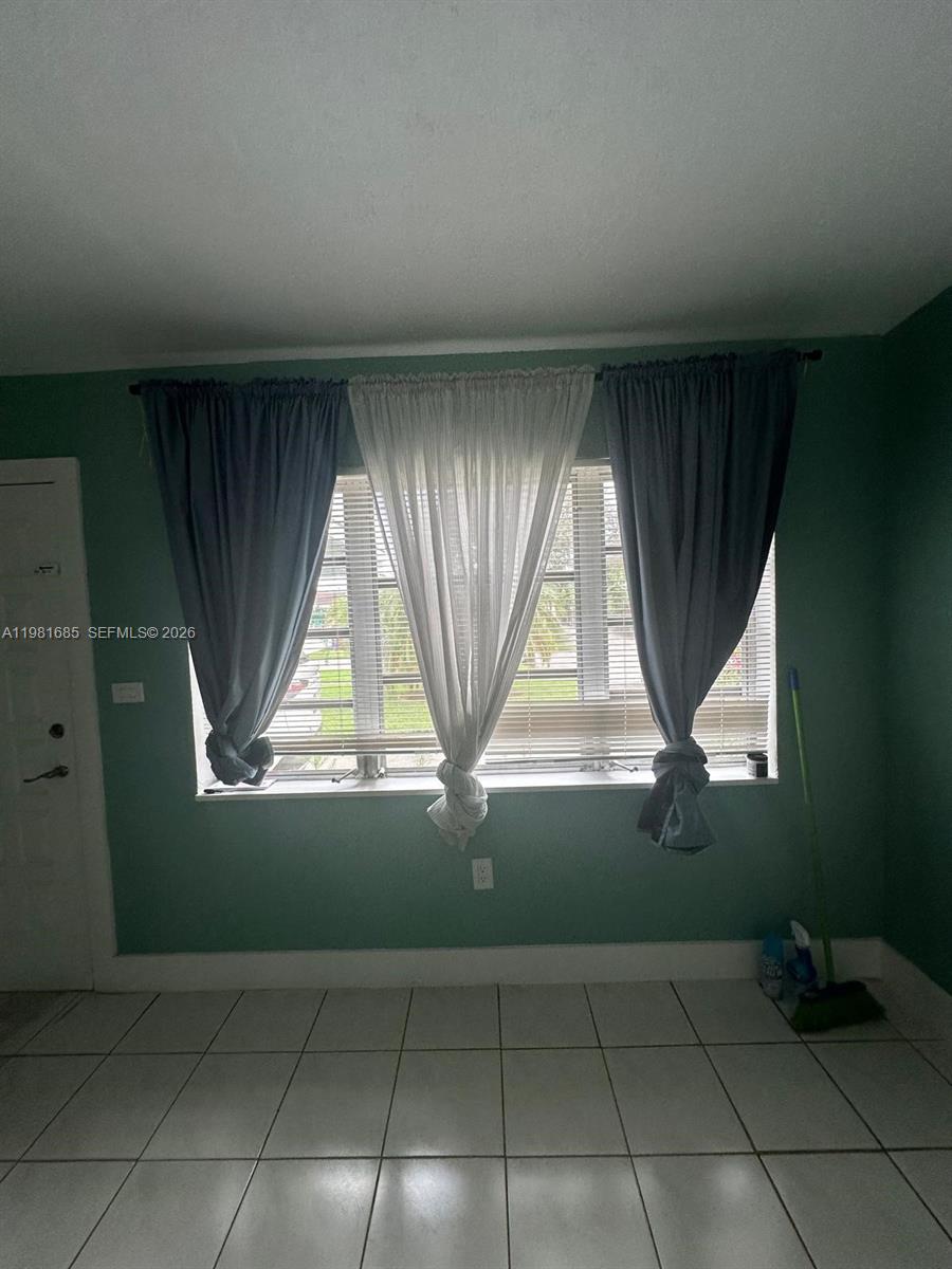 6443 Perry Street Hollywood, FL 33024 - Photo 3 of 24 an empty room with windows
