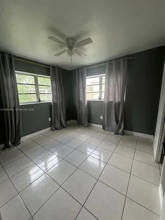 a view of a livingroom with furniture and windows