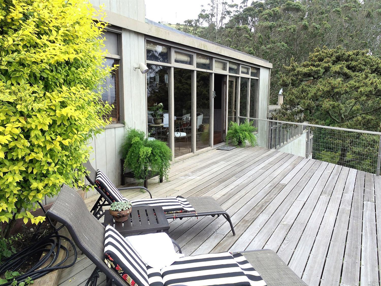 5 Wolfback Ridge Road Sausalito, CA 94965 - Photo 1 of 1 a view of a house with backyard and sitting area