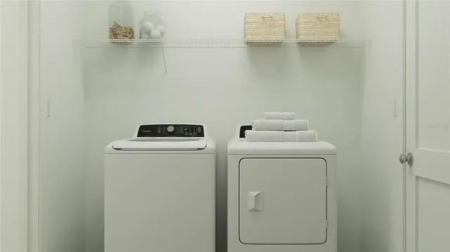 a utility room with dryer and washer