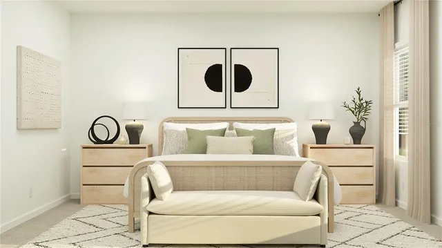 a living room with a couch and a potted plant