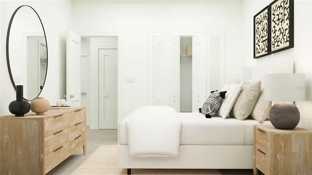 a bedroom with a bed and a mirror