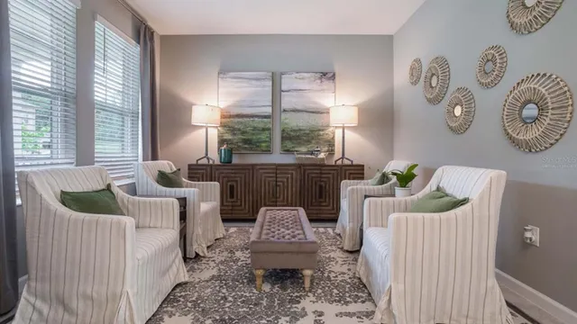 a living room with furniture and a large window