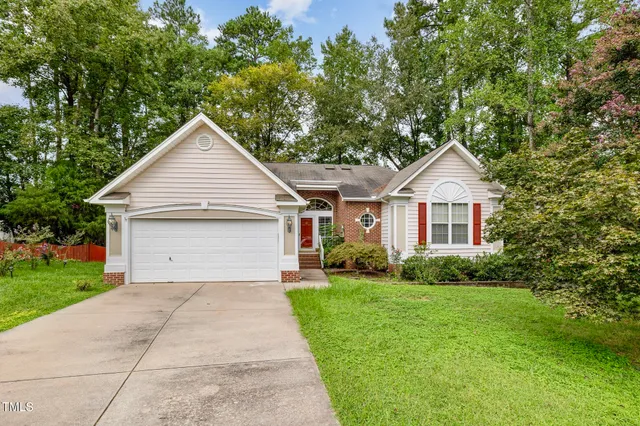 a front view of a house with yard
