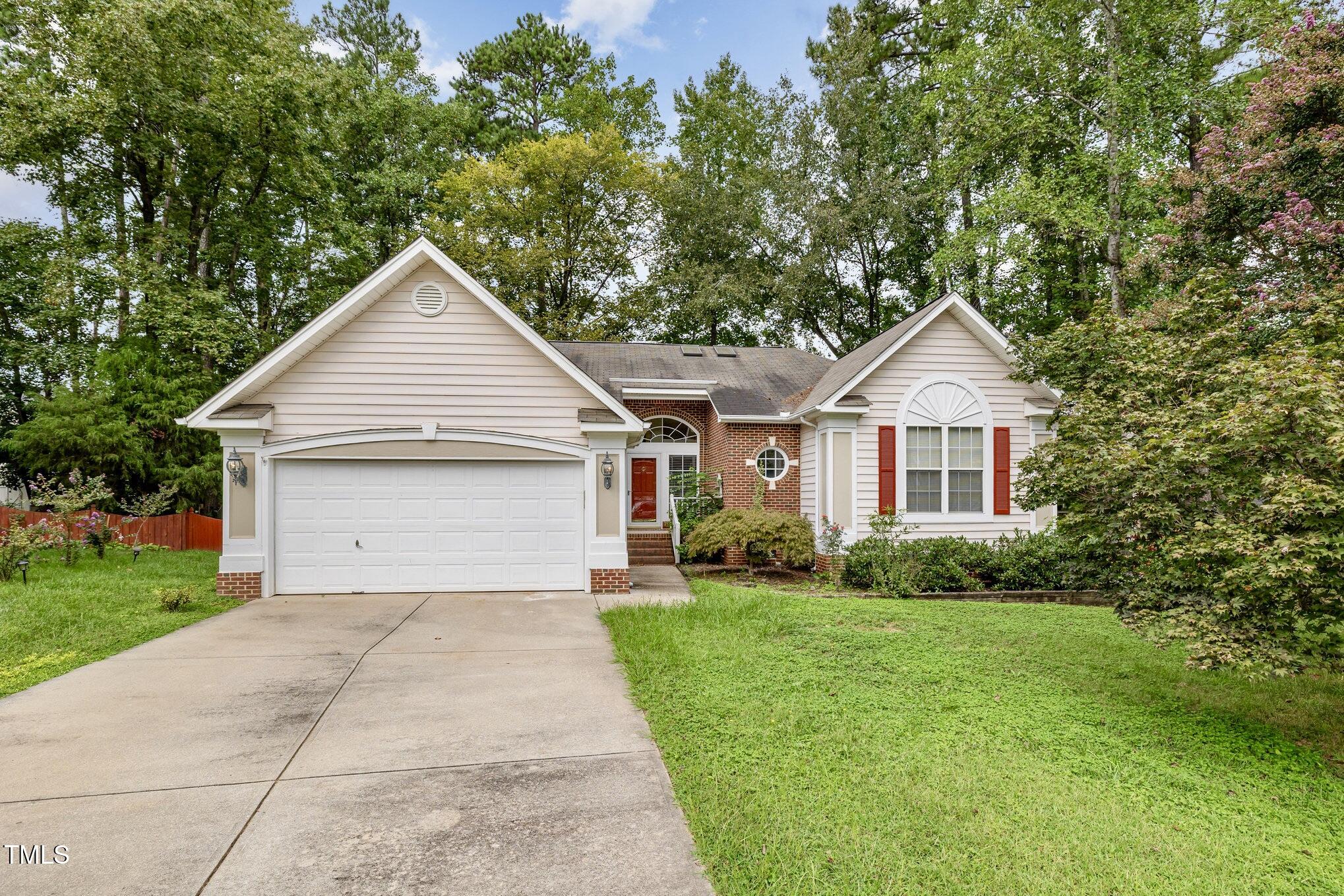 a front view of a house with yard