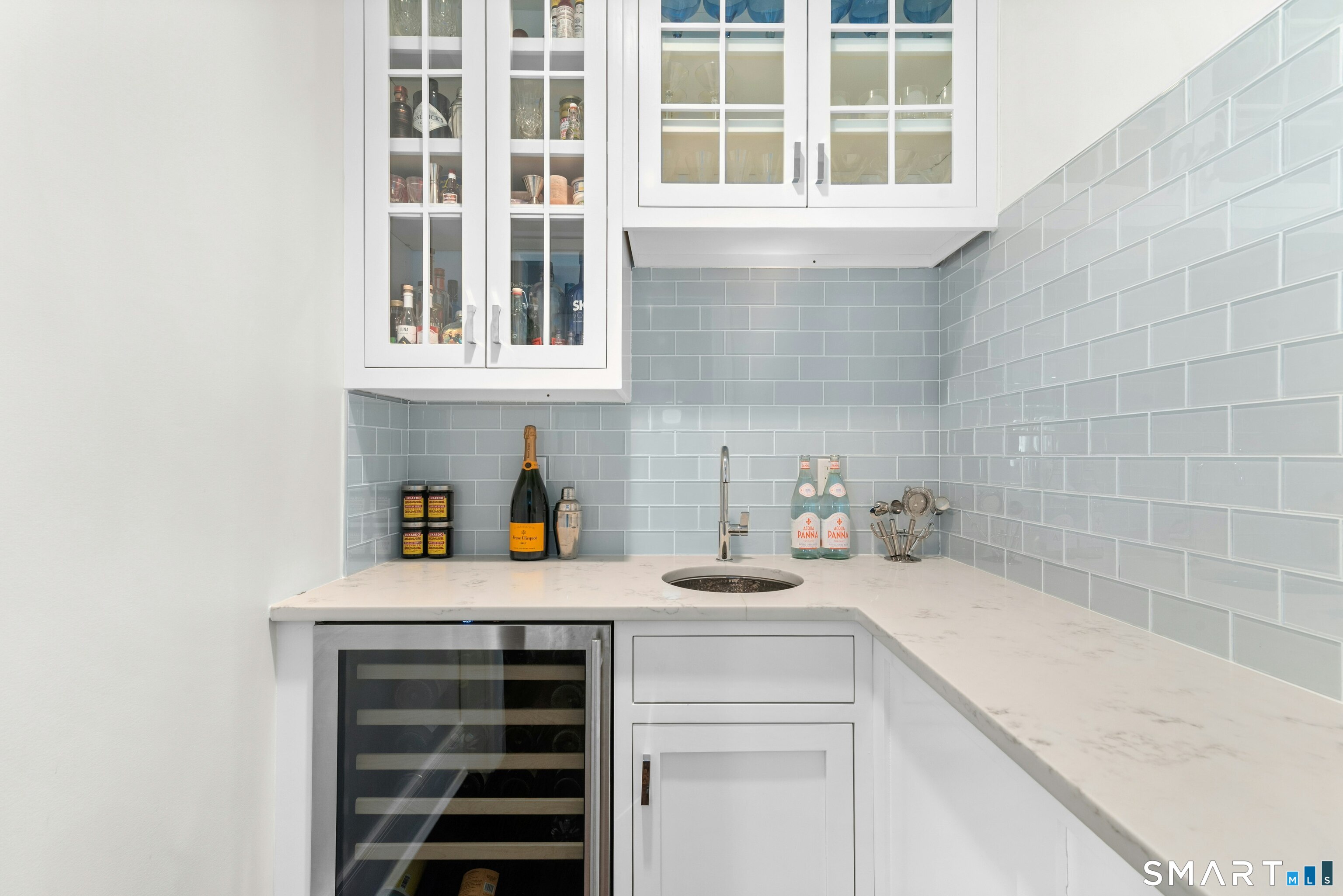 42 Hillcrest Road New Canaan, CT 06840 - Photo 14 of 38 a kitchen with a sink and cabinets
