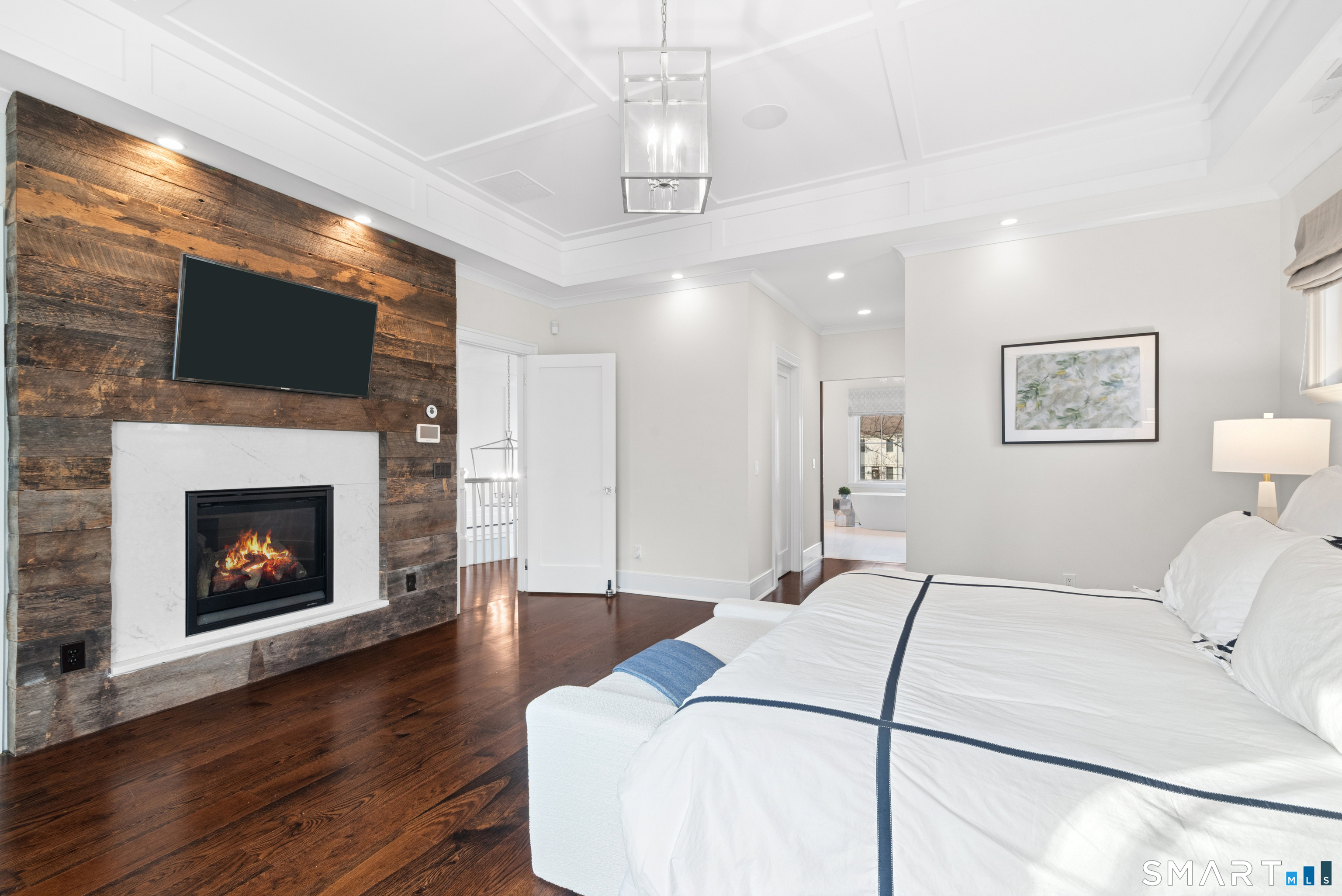 42 Hillcrest Road New Canaan, CT 06840 - Photo 19 of 38 a bed room with a bed and a fireplace