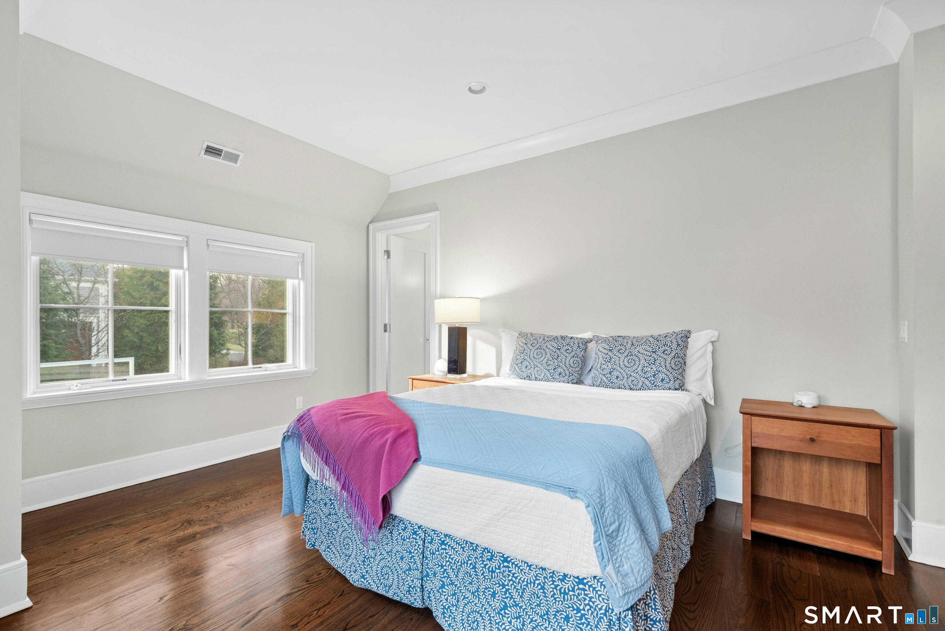 42 Hillcrest Road New Canaan, CT 06840 - Photo 24 of 38 a bedroom with a bed and wooden floor