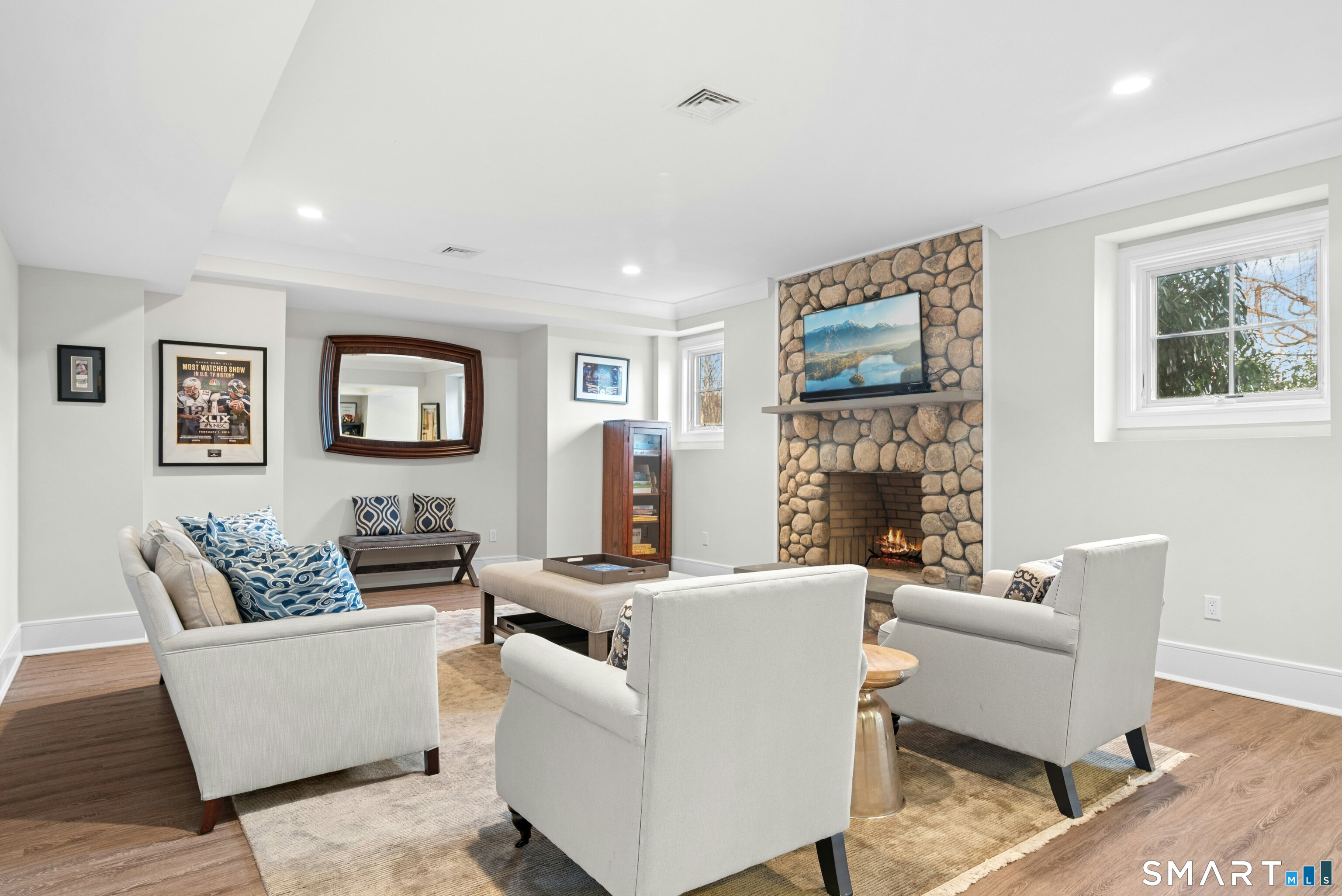 42 Hillcrest Road New Canaan, CT 06840 - Photo 31 of 38 a living room with furniture a couch and a wall painting