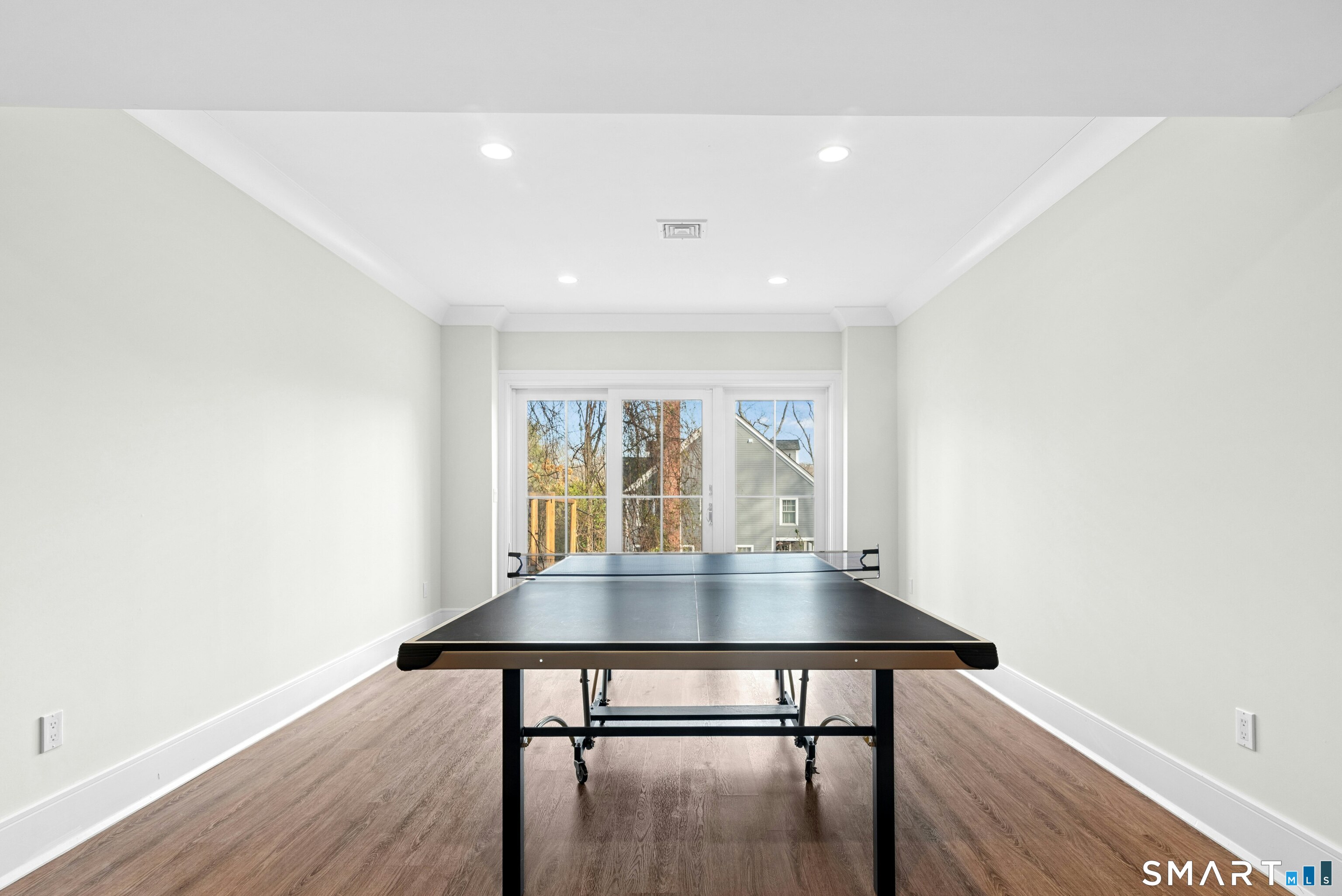 42 Hillcrest Road New Canaan, CT 06840 - Photo 33 of 38 a view of a dining room with a table and chairs