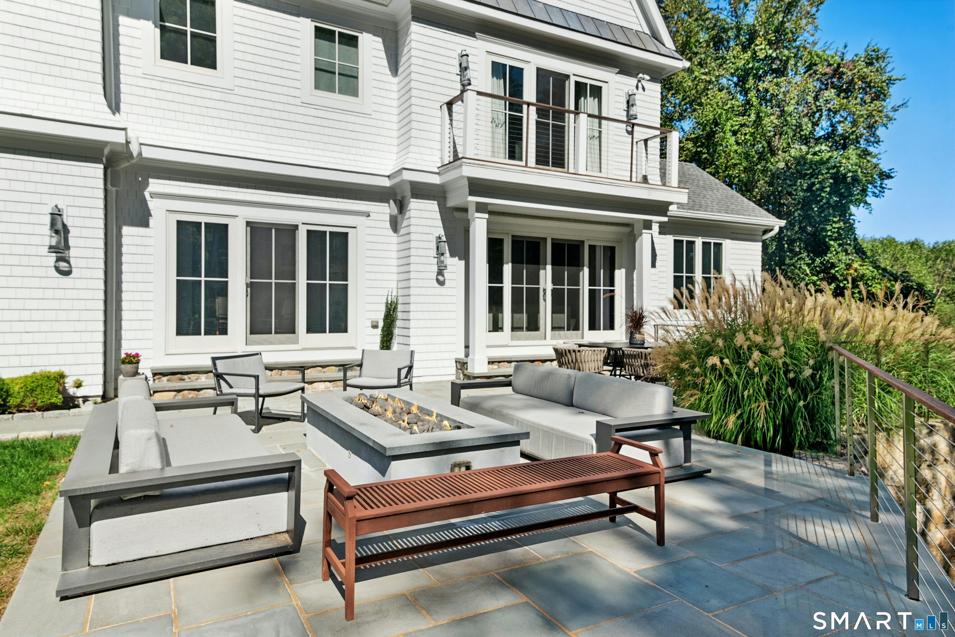 42 Hillcrest Road New Canaan, CT 06840 - Photo 35 of 38 a roof deck with a couches and potted plants