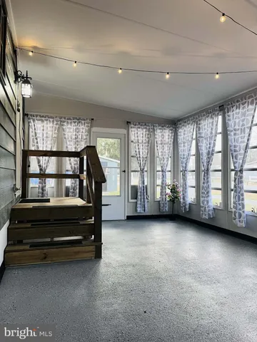 a view of an empty room with stairs