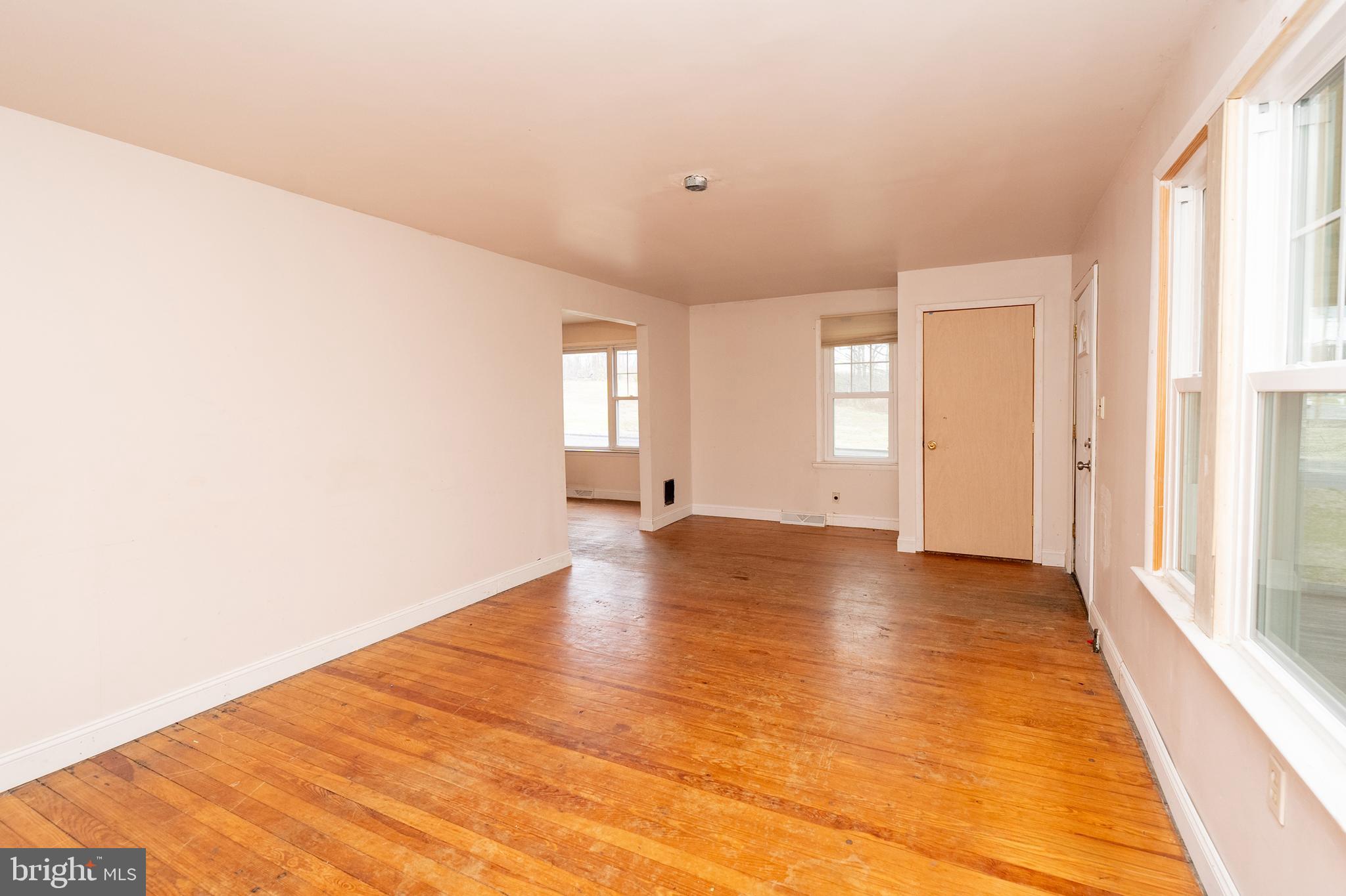 1401 Glassboro Road Wenonah, NJ 08090 - Photo 14 of 41 a view of an empty room with window and wooden floor