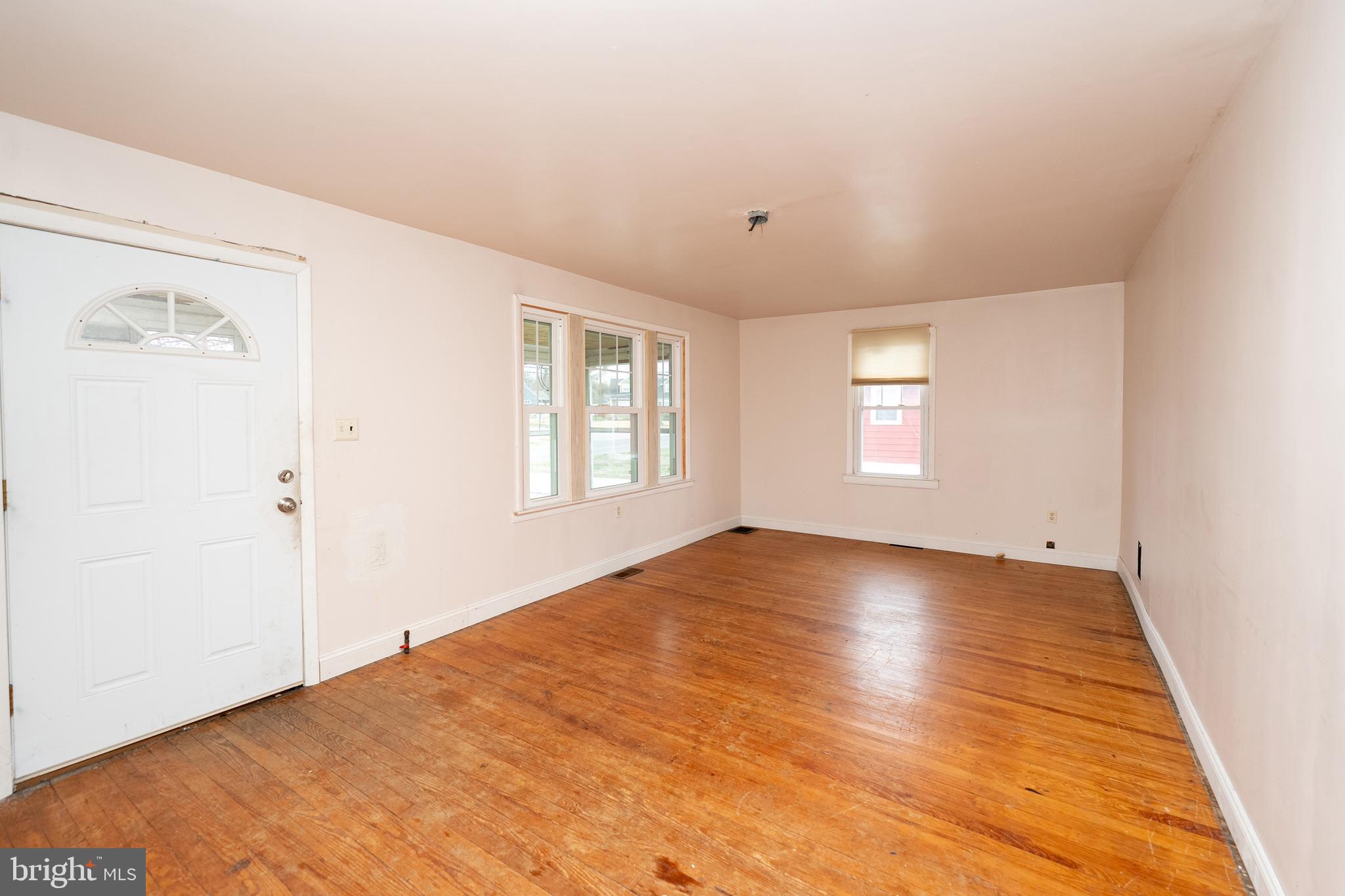 1401 Glassboro Road Wenonah, NJ 08090 - Photo 16 of 41 an empty room with wooden floor and windows