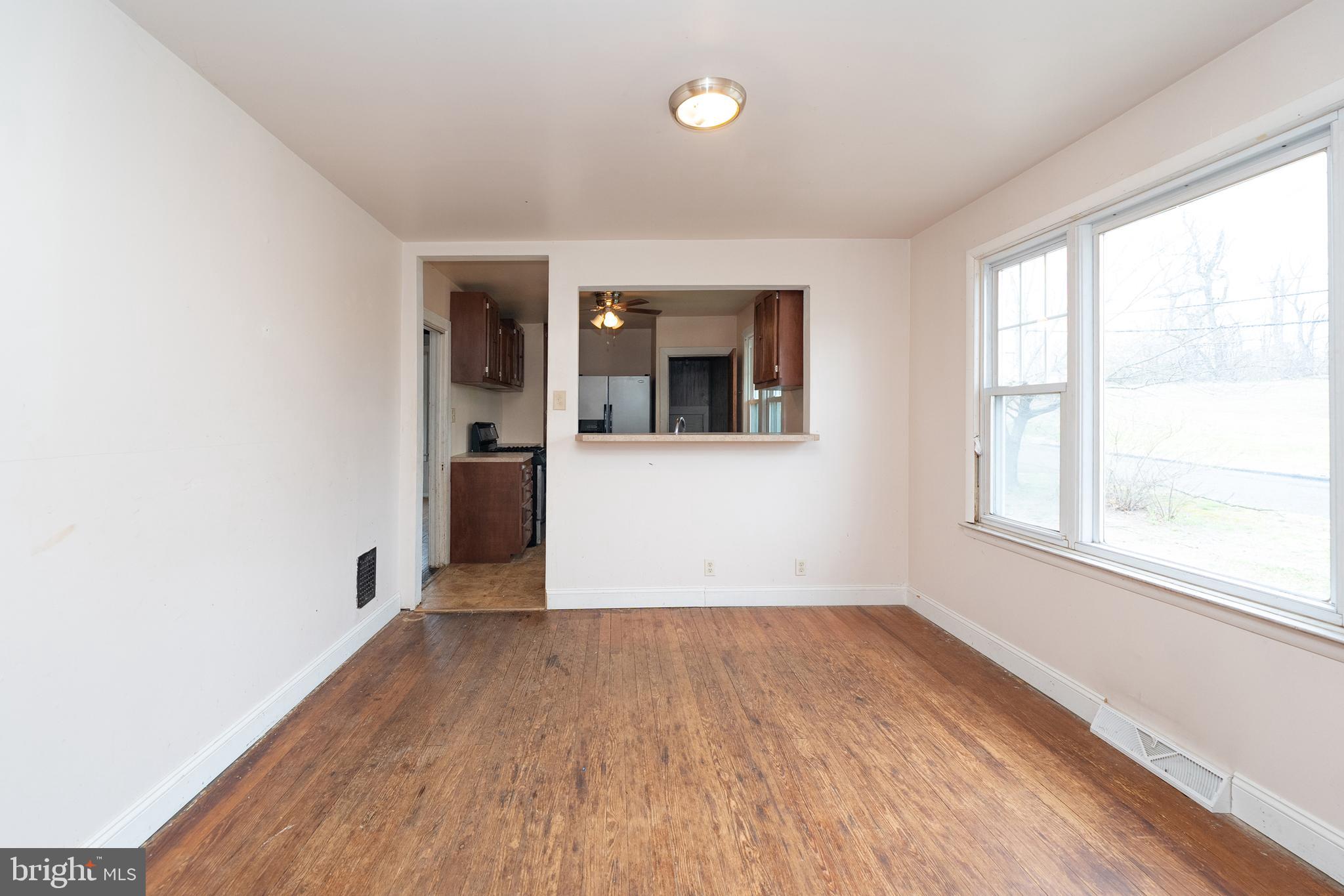 1401 Glassboro Road Wenonah, NJ 08090 - Photo 17 of 41 an empty room with wooden floor and windows