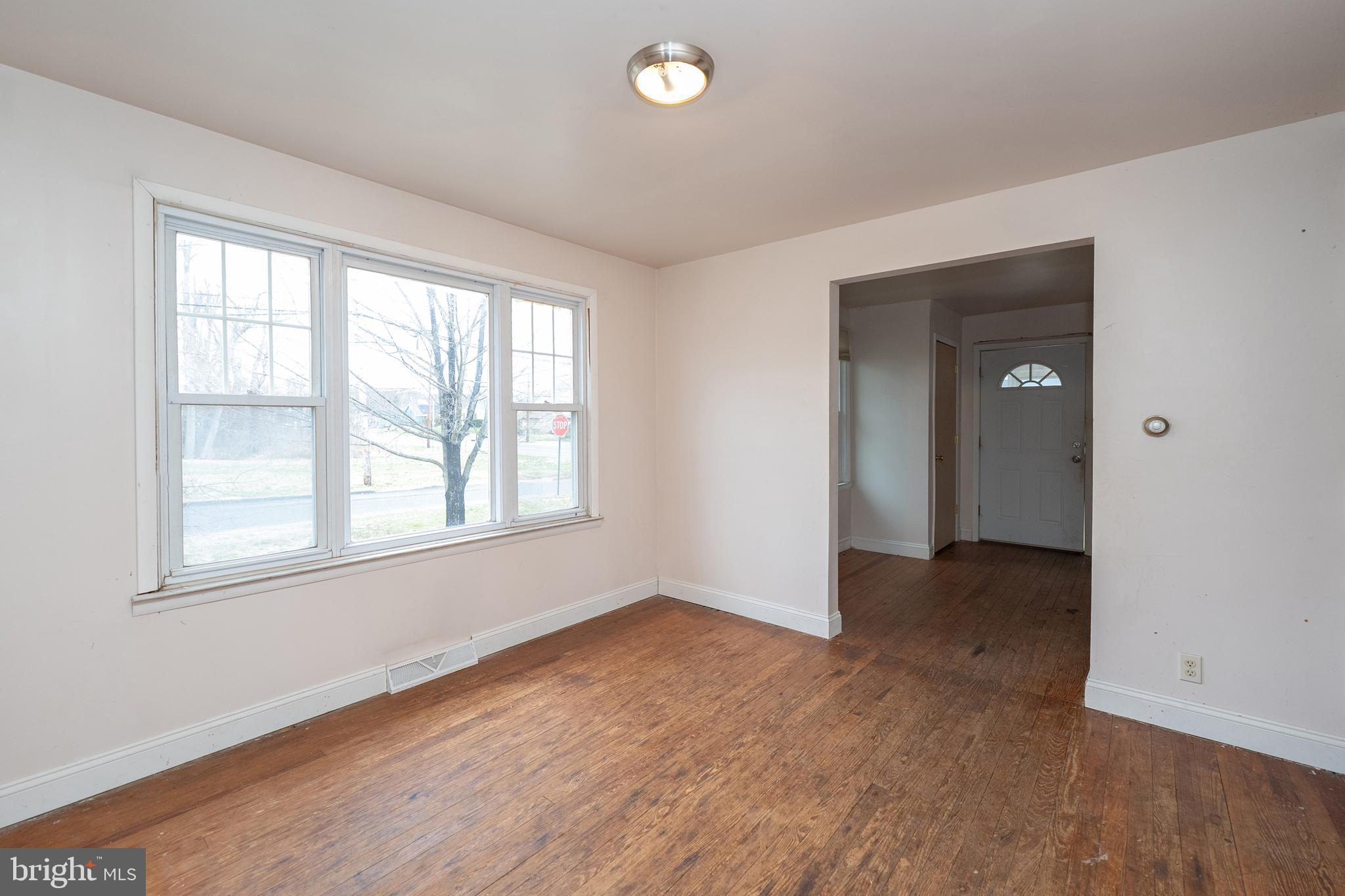 1401 Glassboro Road Wenonah, NJ 08090 - Photo 19 of 41 an empty room with wooden floor and windows