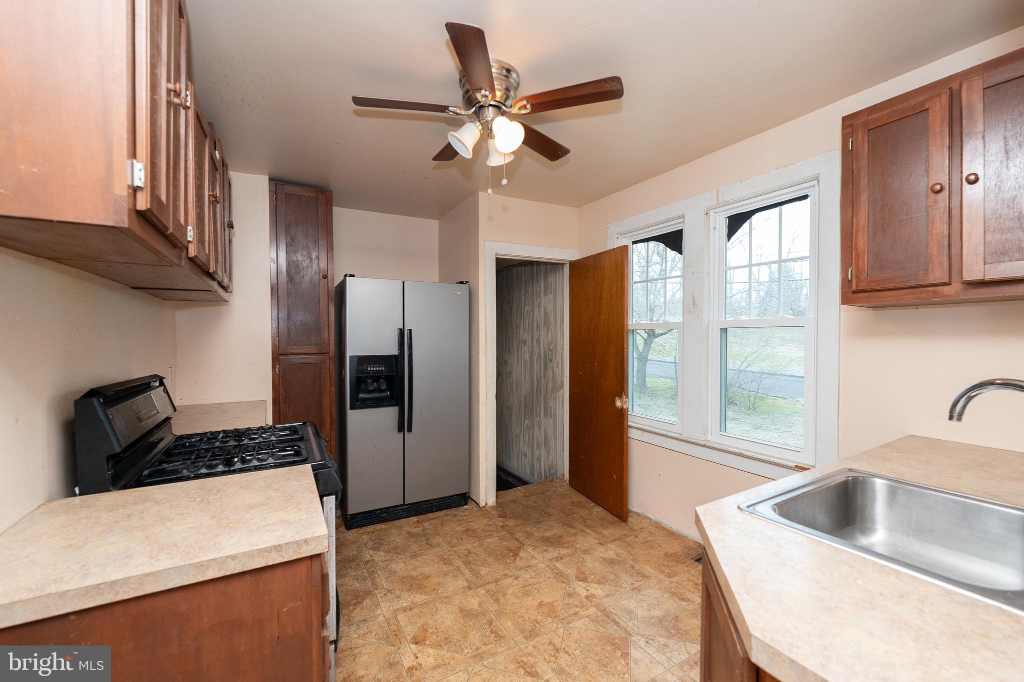 1401 Glassboro Road Wenonah, NJ 08090 - Photo 20 of 41 a kitchen with a refrigerator and a sink