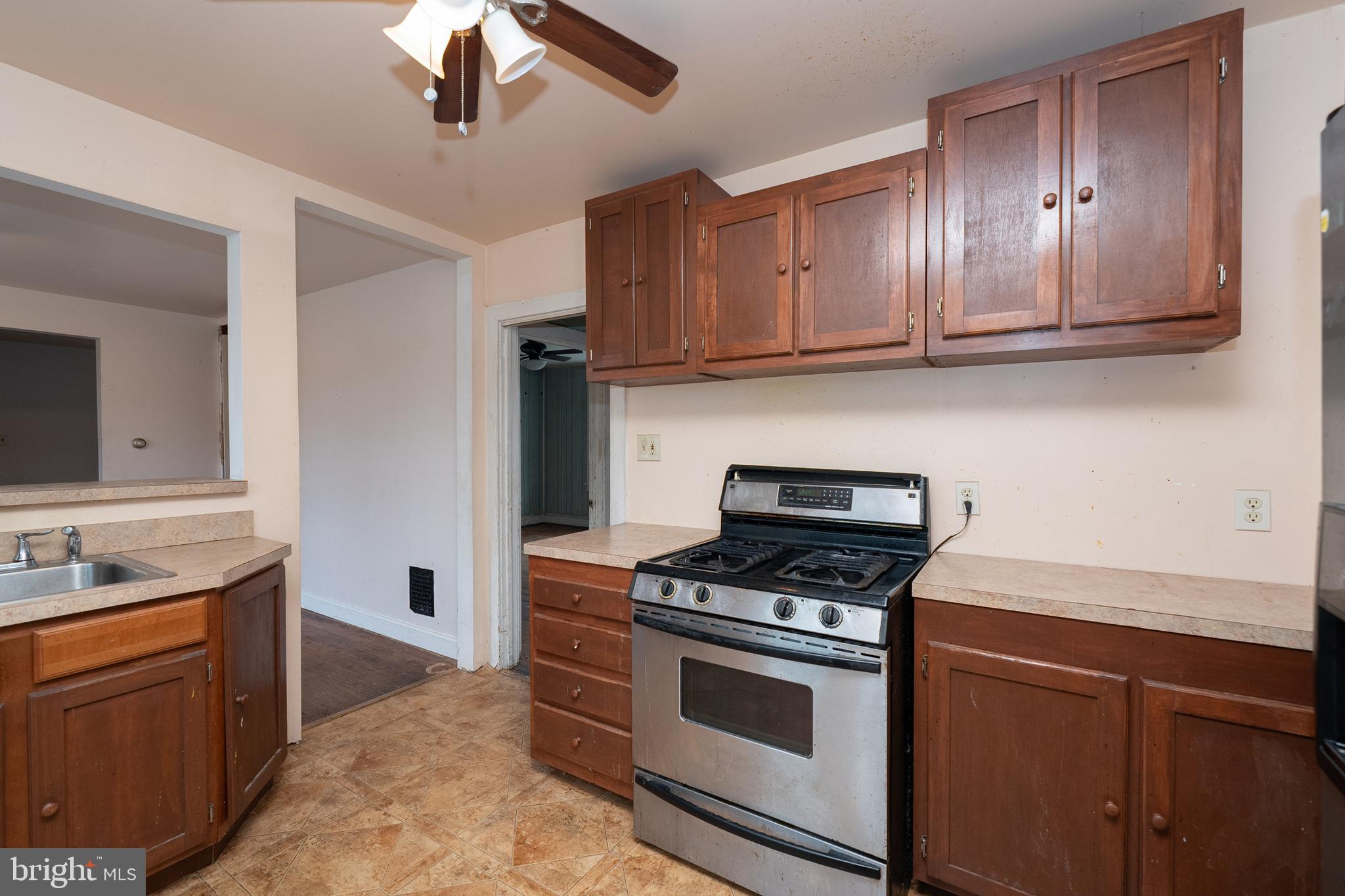 1401 Glassboro Road Wenonah, NJ 08090 - Photo 22 of 41 a kitchen with stainless steel appliances granite countertop a sink a stove and cabinets