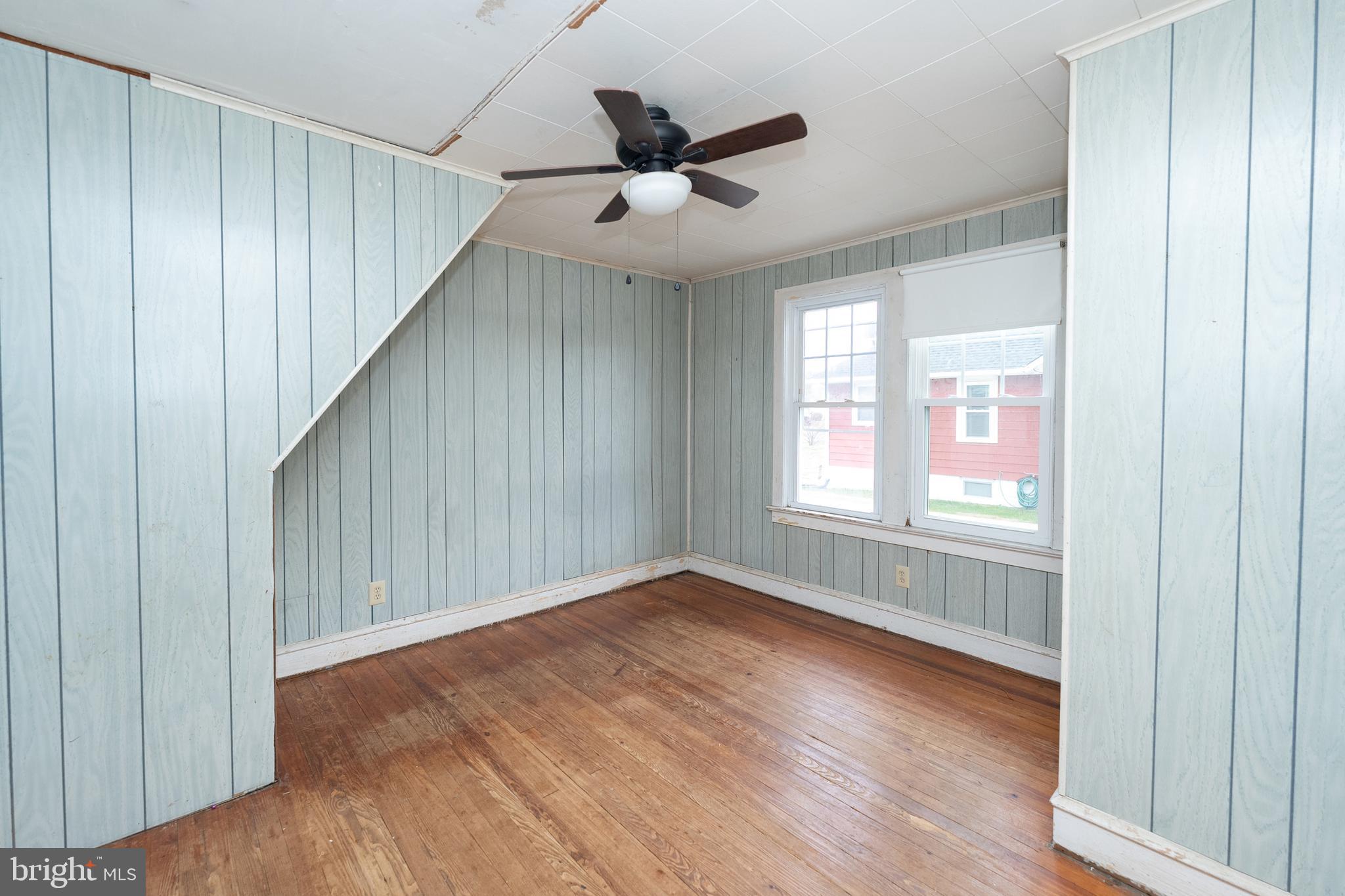 1401 Glassboro Road Wenonah, NJ 08090 - Photo 25 of 41 an empty room with wooden floor fan and windows