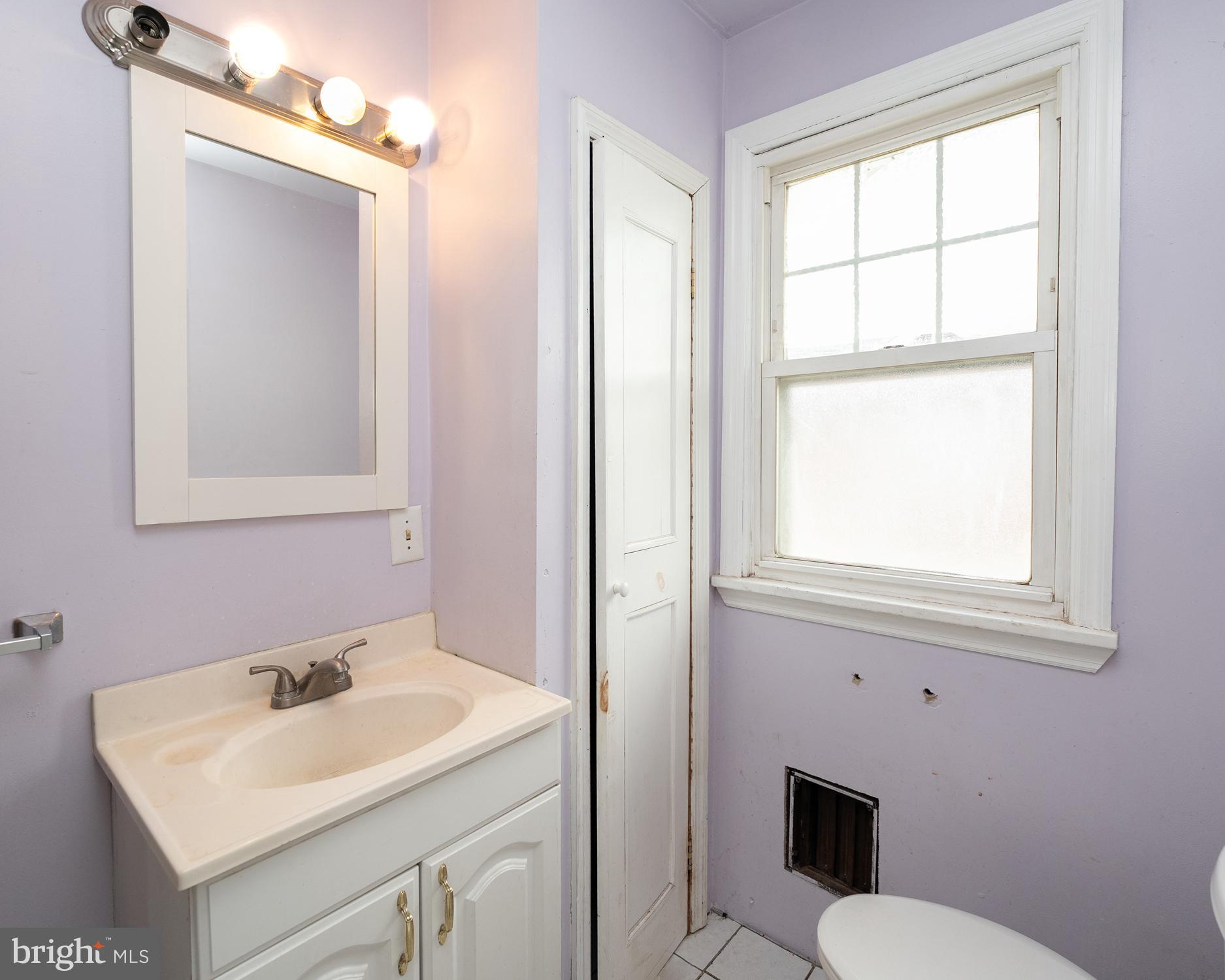 1401 Glassboro Road Wenonah, NJ 08090 - Photo 37 of 41 a bathroom with a sink toilet and mirror