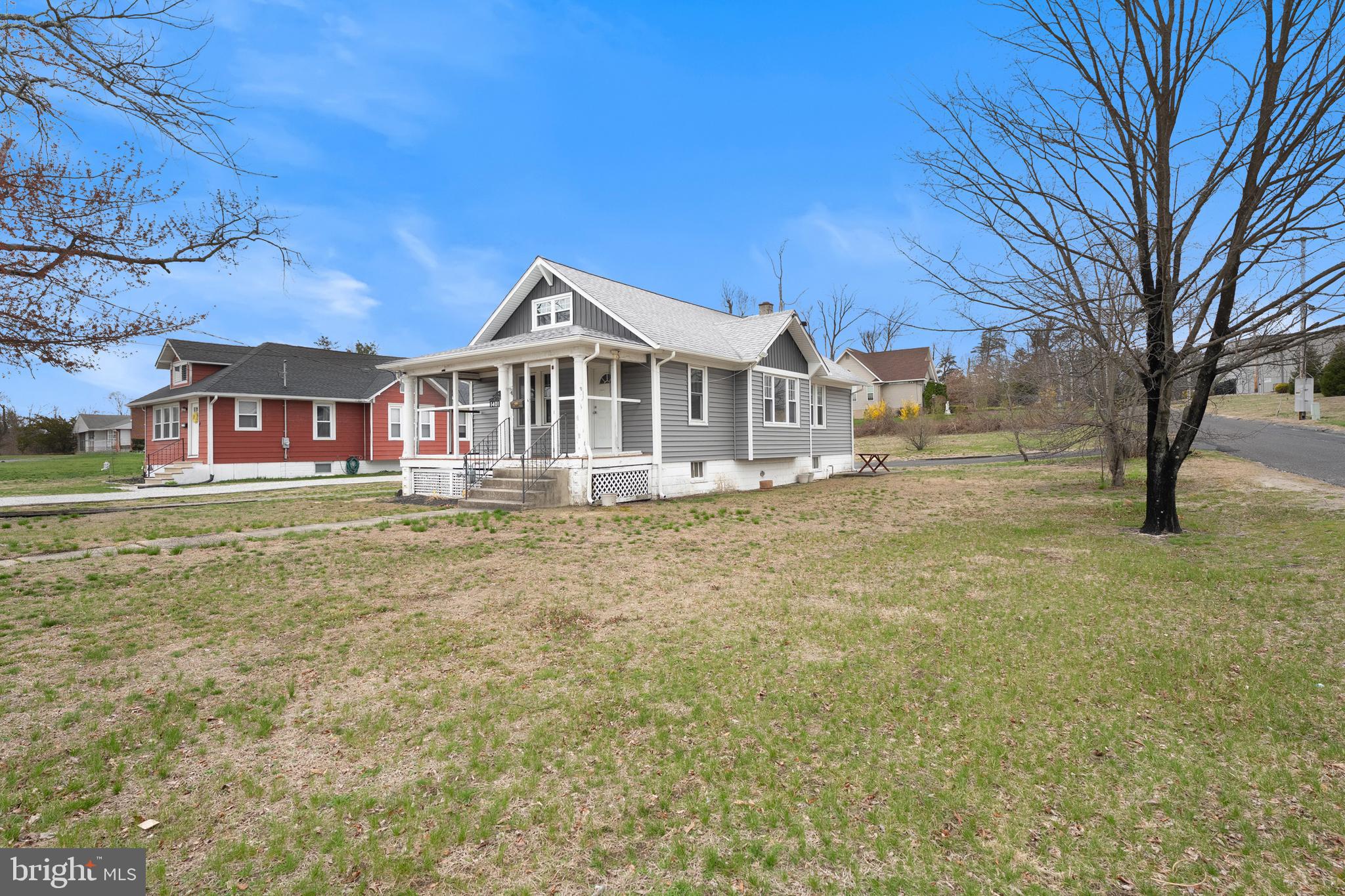 1401 Glassboro Road Wenonah, NJ 08090 - Photo 4 of 41 a front view of a house with a garden