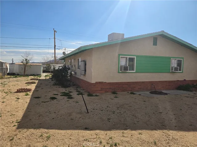 a view of a backyard of a house