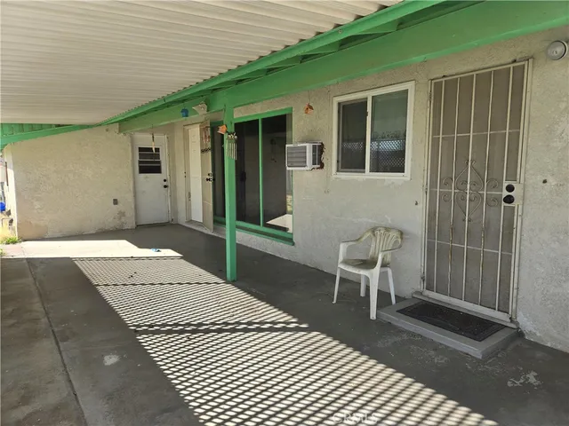 a balcony view with a sitting space