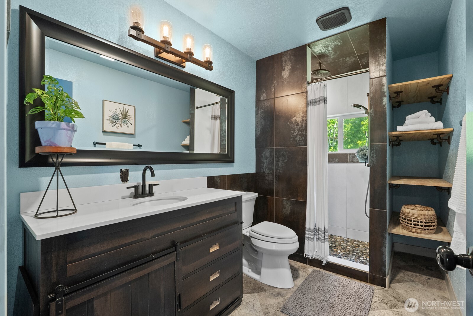 307 4th Street Steilacoom, WA 98388 - Photo 23 of 39 a bathroom with a toilet sink and mirror