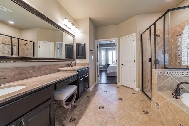 a view of a bathroom with sink and mirror