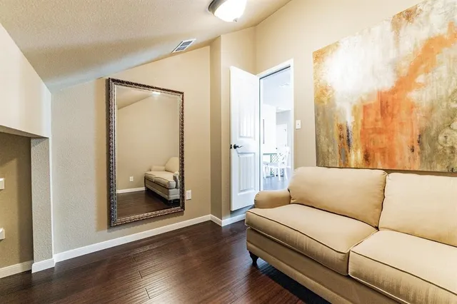 a living room with furniture and a gate