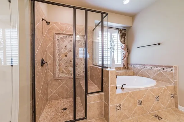 a bathroom with a tub and a sink
