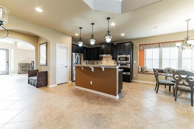 a view of a kitchen and dining area