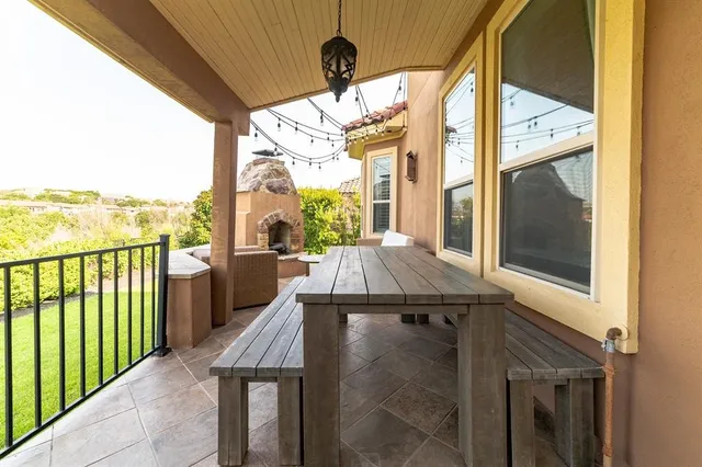 a view of balcony with furniture