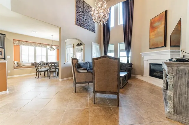a dining room with furniture and a fireplace