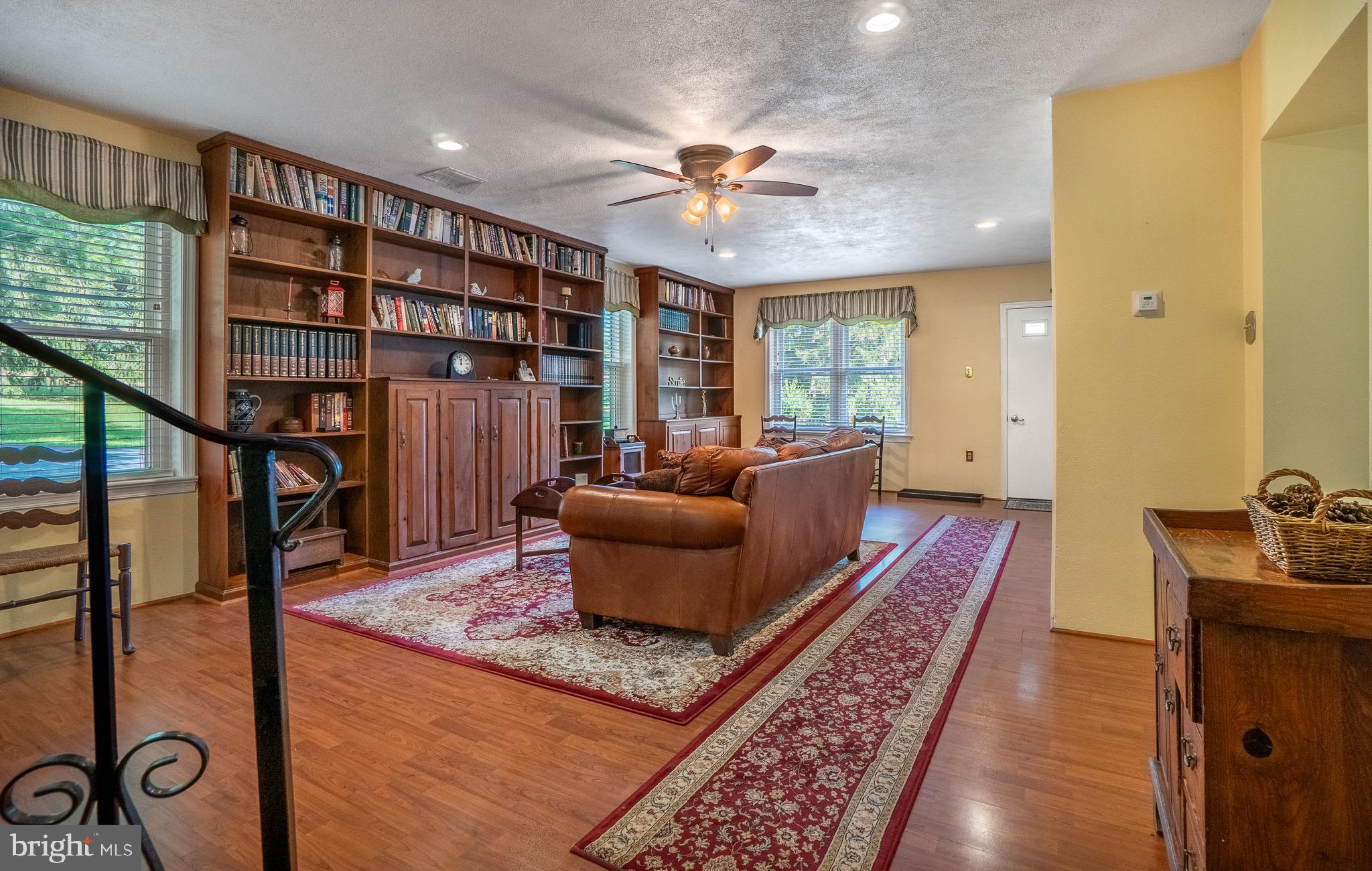 1453 Coldsprings Road Pottstown, PA 19465 - Photo 14 of 53 a living room with furniture and a book shelf