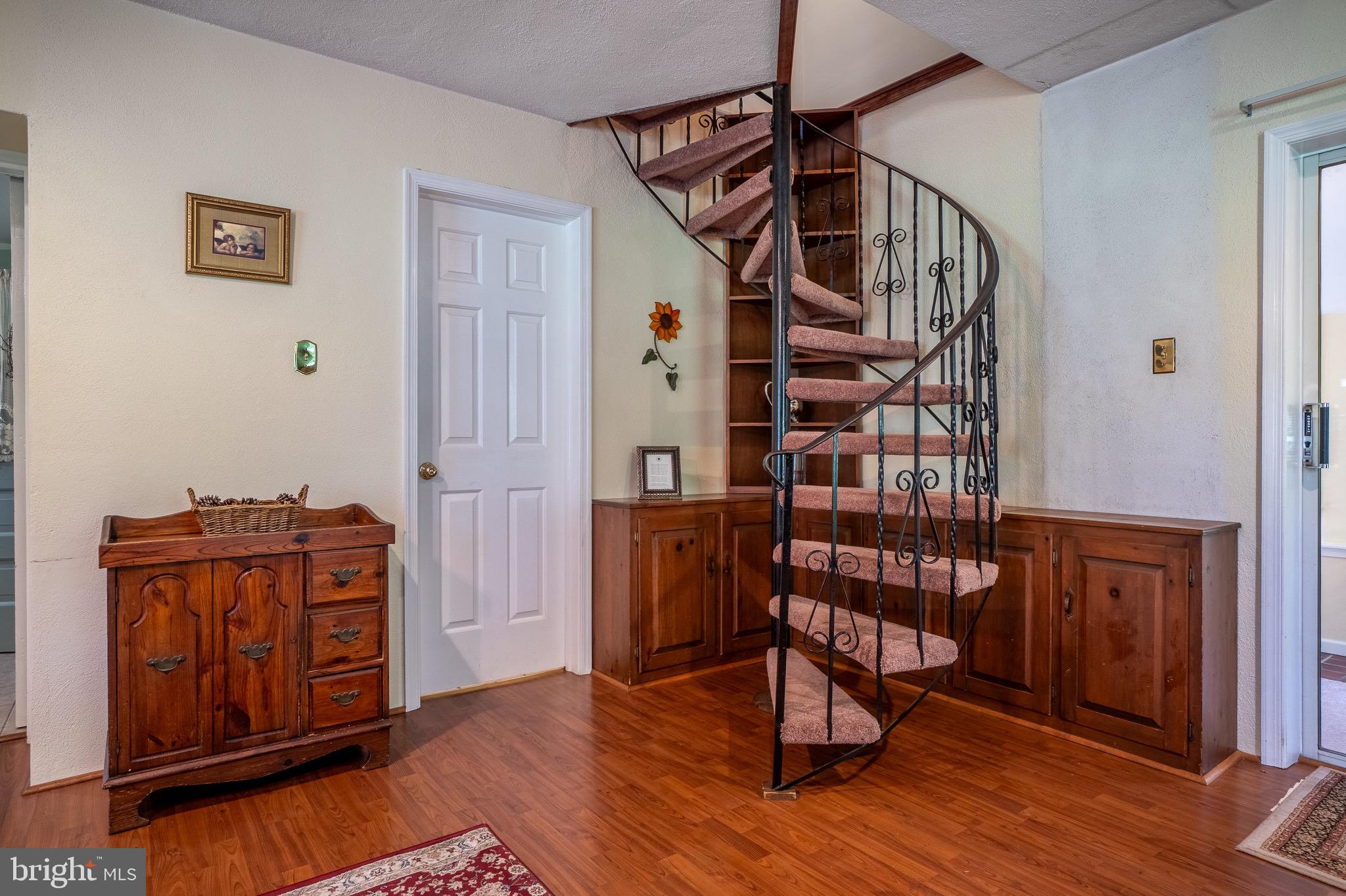 1453 Coldsprings Road Pottstown, PA 19465 - Photo 16 of 53 a view of a hallway with wooden floor and staircase