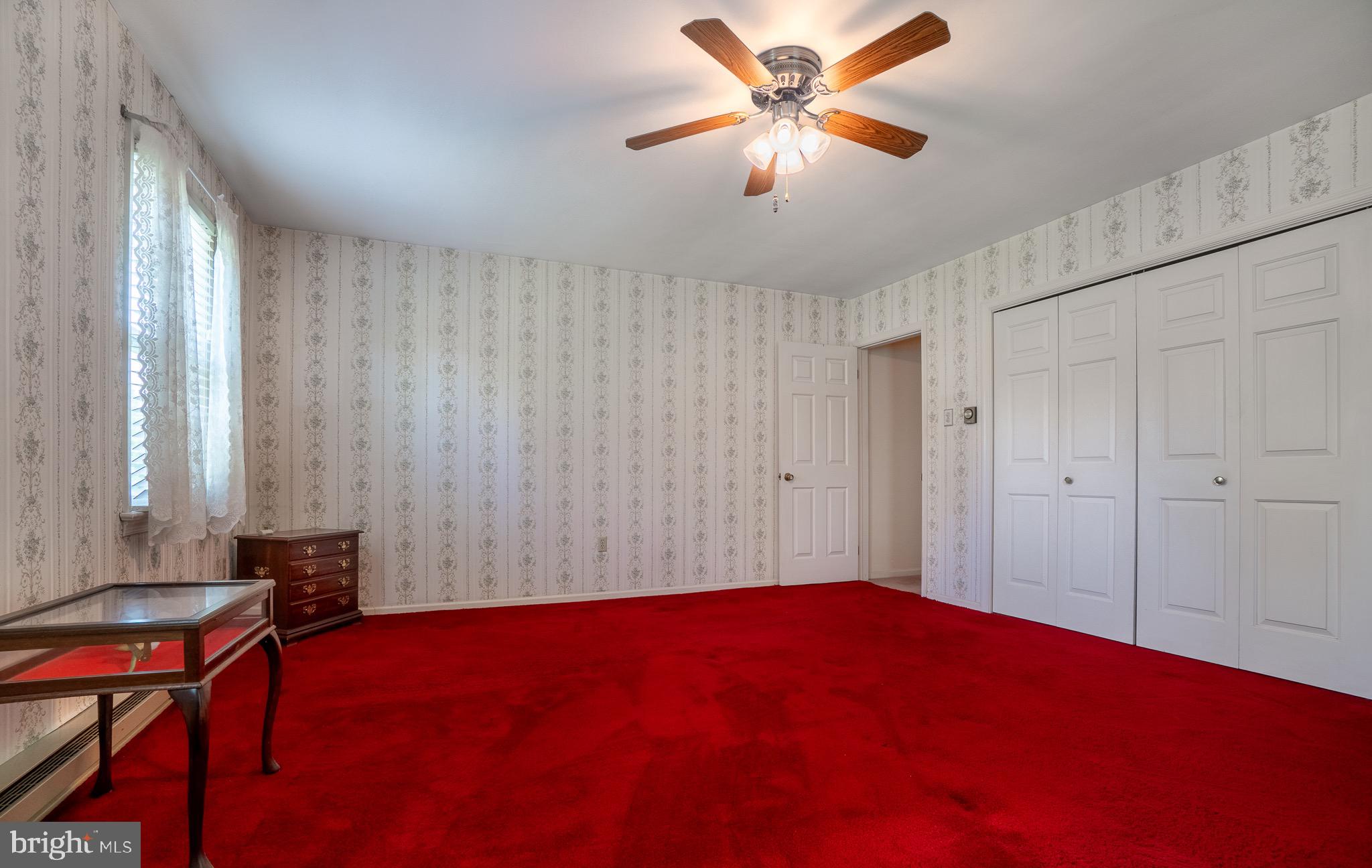 1453 Coldsprings Road Pottstown, PA 19465 - Photo 21 of 53 a living room with a bed furniture and a window