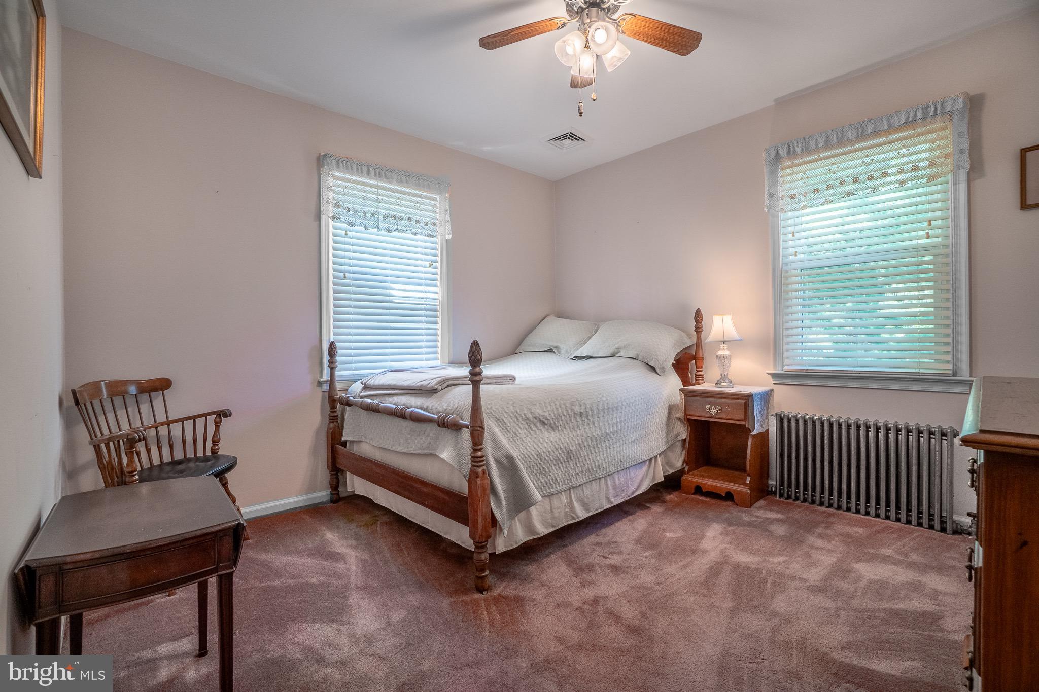 1453 Coldsprings Road Pottstown, PA 19465 - Photo 22 of 53 a bedroom with a bed and a chair