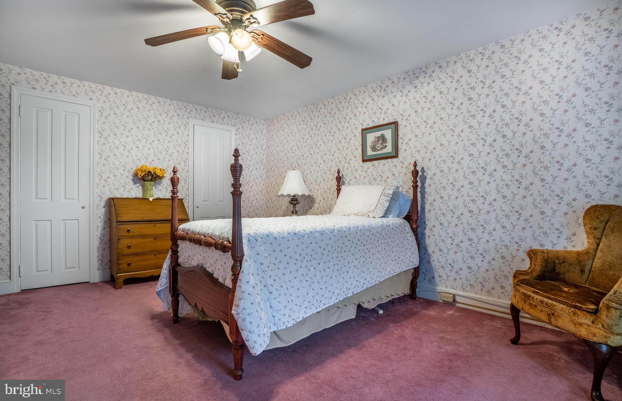 1453 Coldsprings Road Pottstown, PA 19465 - Photo 27 of 53 a bedroom with a bed and a chandelier