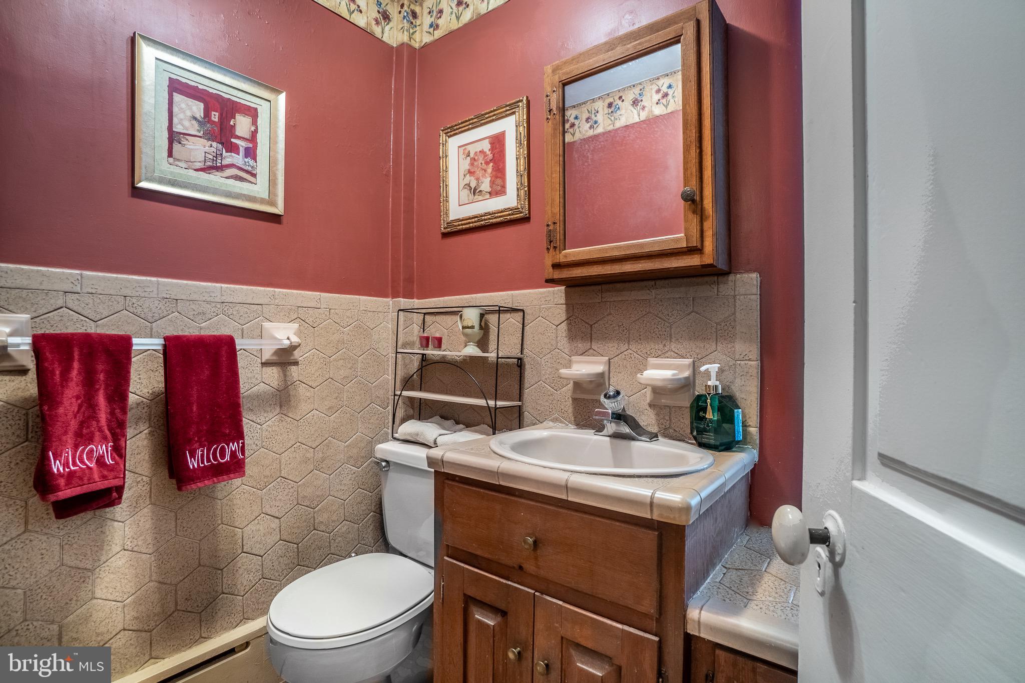 1453 Coldsprings Road Pottstown, PA 19465 - Photo 28 of 53 a bathroom with a sink toilet and vanity