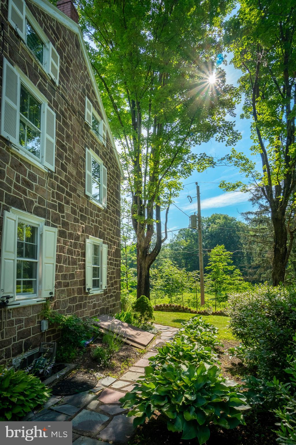 1453 Coldsprings Road Pottstown, PA 19465 - Photo 44 of 53 a view of a yard in front of a house with a fountain
