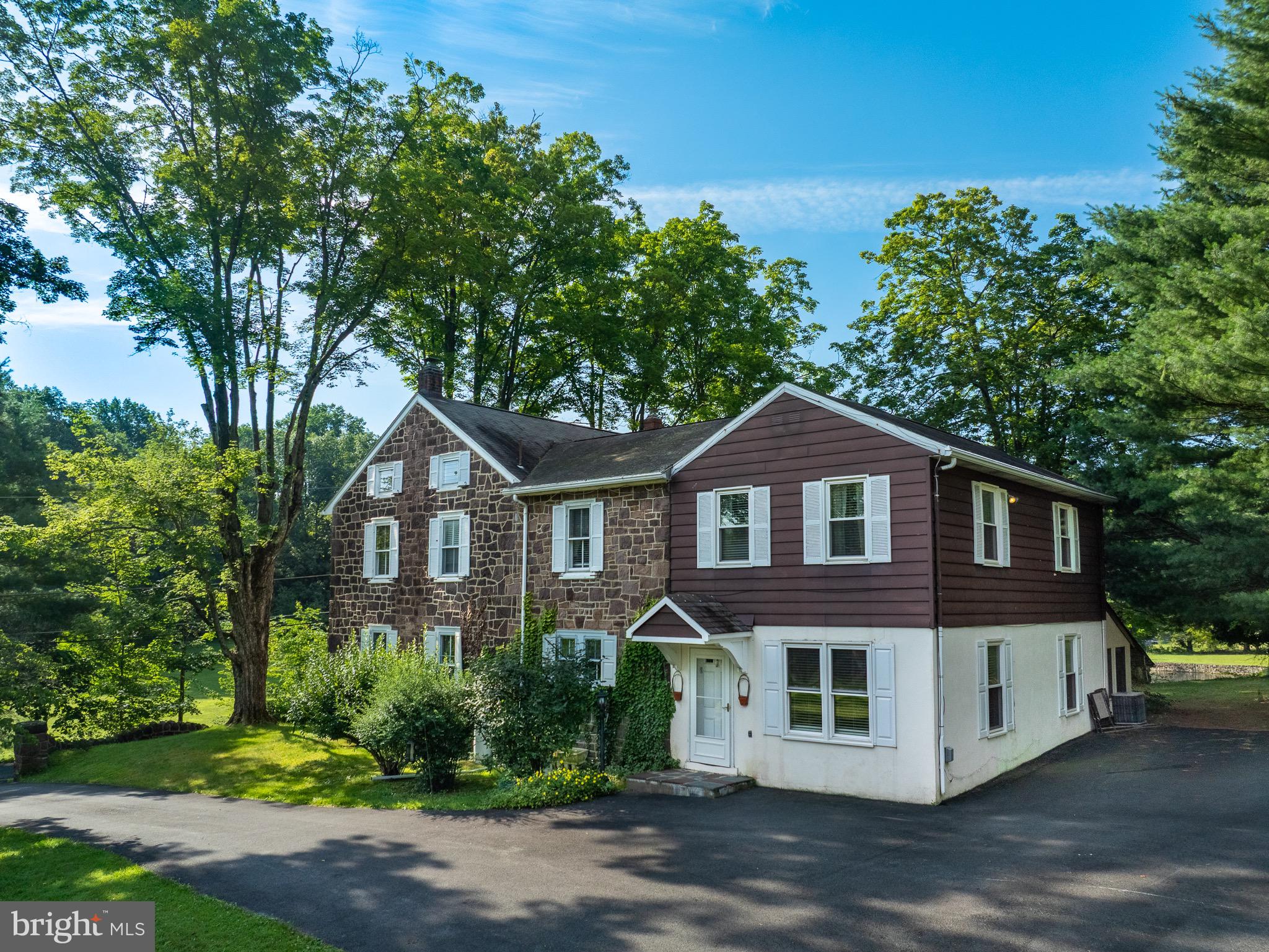1453 Coldsprings Road Pottstown, PA 19465 - Photo 6 of 53 a front view of a house with a yard and trees