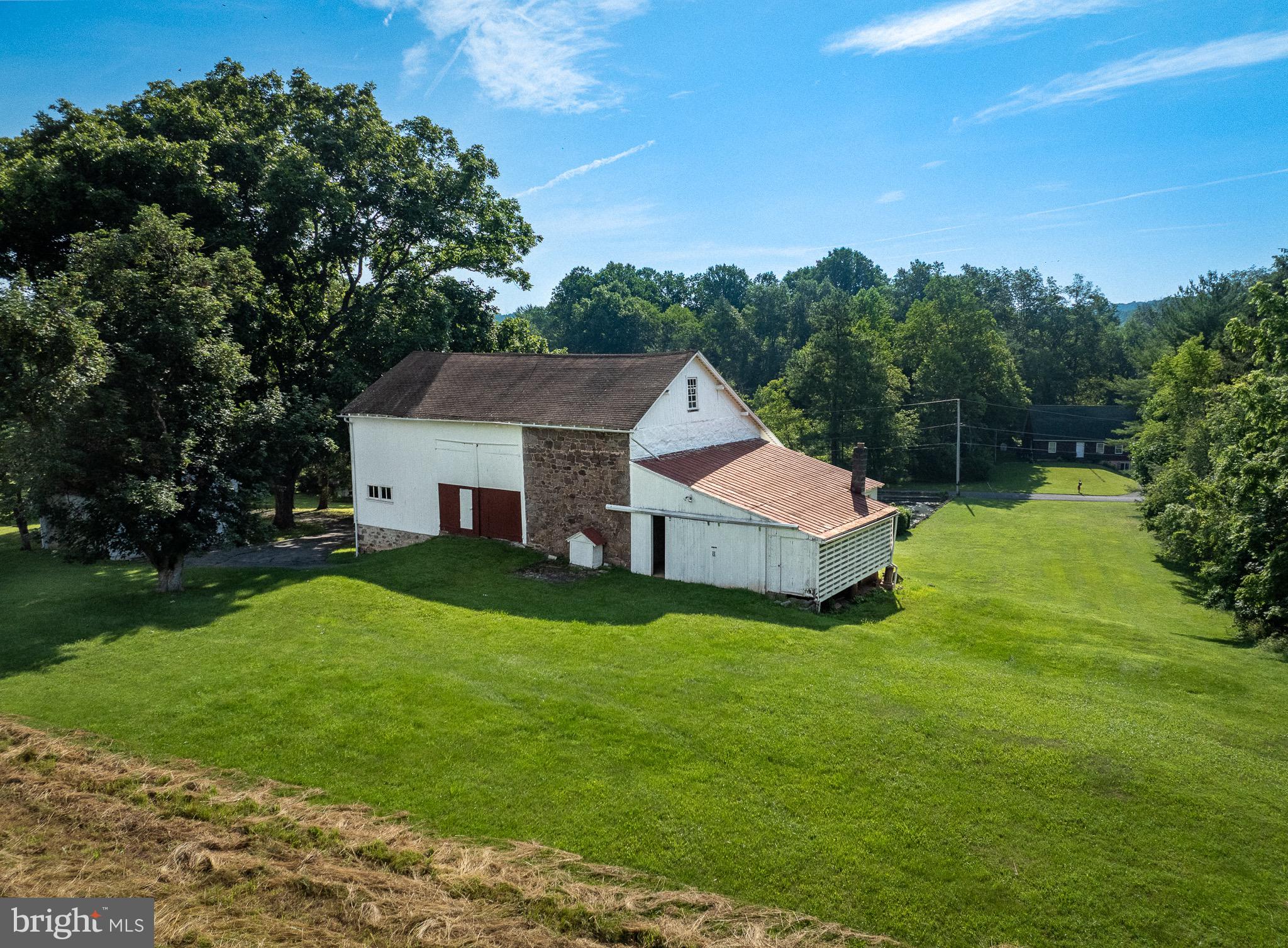 1453 Coldsprings Road Pottstown, PA 19465 - Photo 7 of 53 a aerial view of a house next to a big yard and large trees