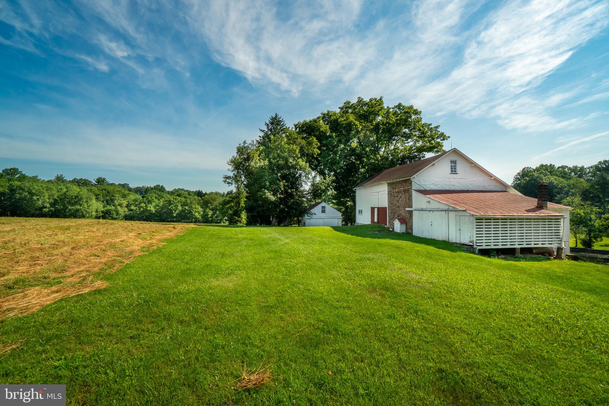 1453 Coldsprings Road Pottstown, PA 19465 - Photo 8 of 53 a house with green field in front of it