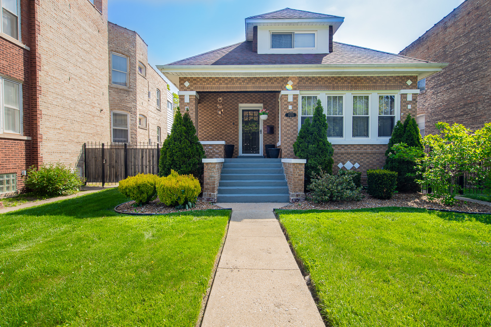10215 South Charles Street Chicago, IL 60643 - Photo 1 of 33 a front view of a house with garden