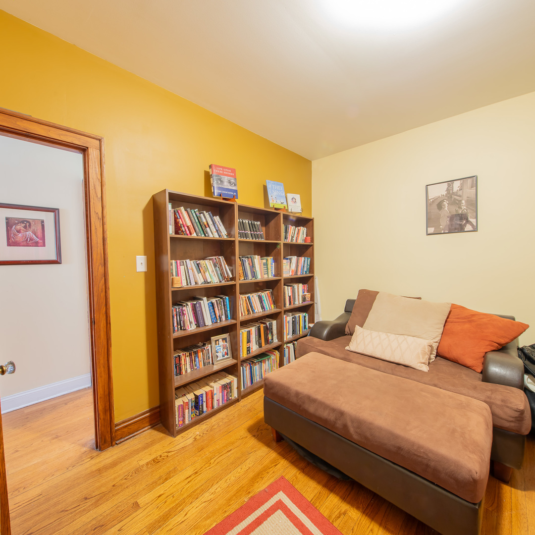 10215 South Charles Street Chicago, IL 60643 - Photo 13 of 33 a bedroom with a bed and a book shelf